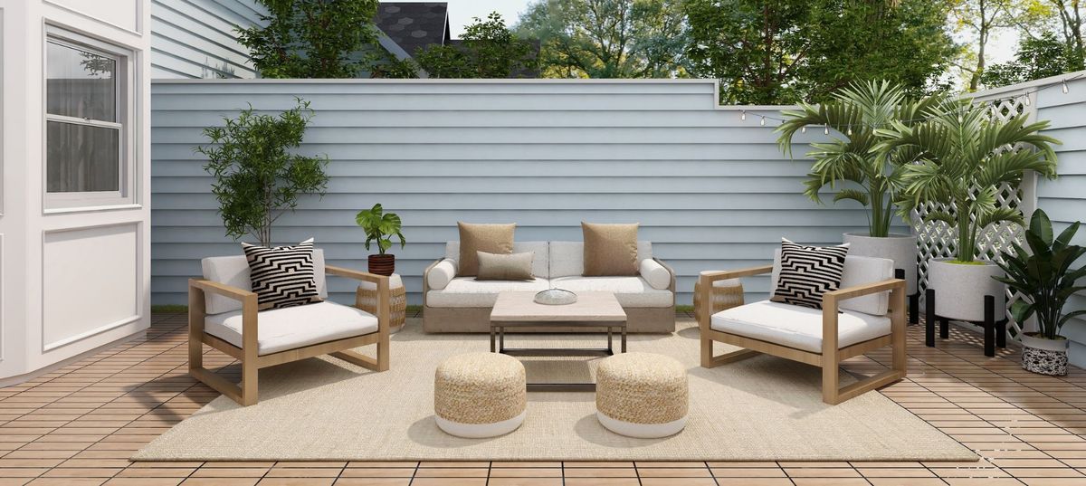 Naturfarbene Boho-Lounge mit Teppich und Poufs Naturfarbene Boho-Lounge mit Teppich und Poufs